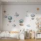 Nursery room adorned with our textile decals, featuring vintage ships and hot air balloons, creating a whimsical travel-themed ambiance.